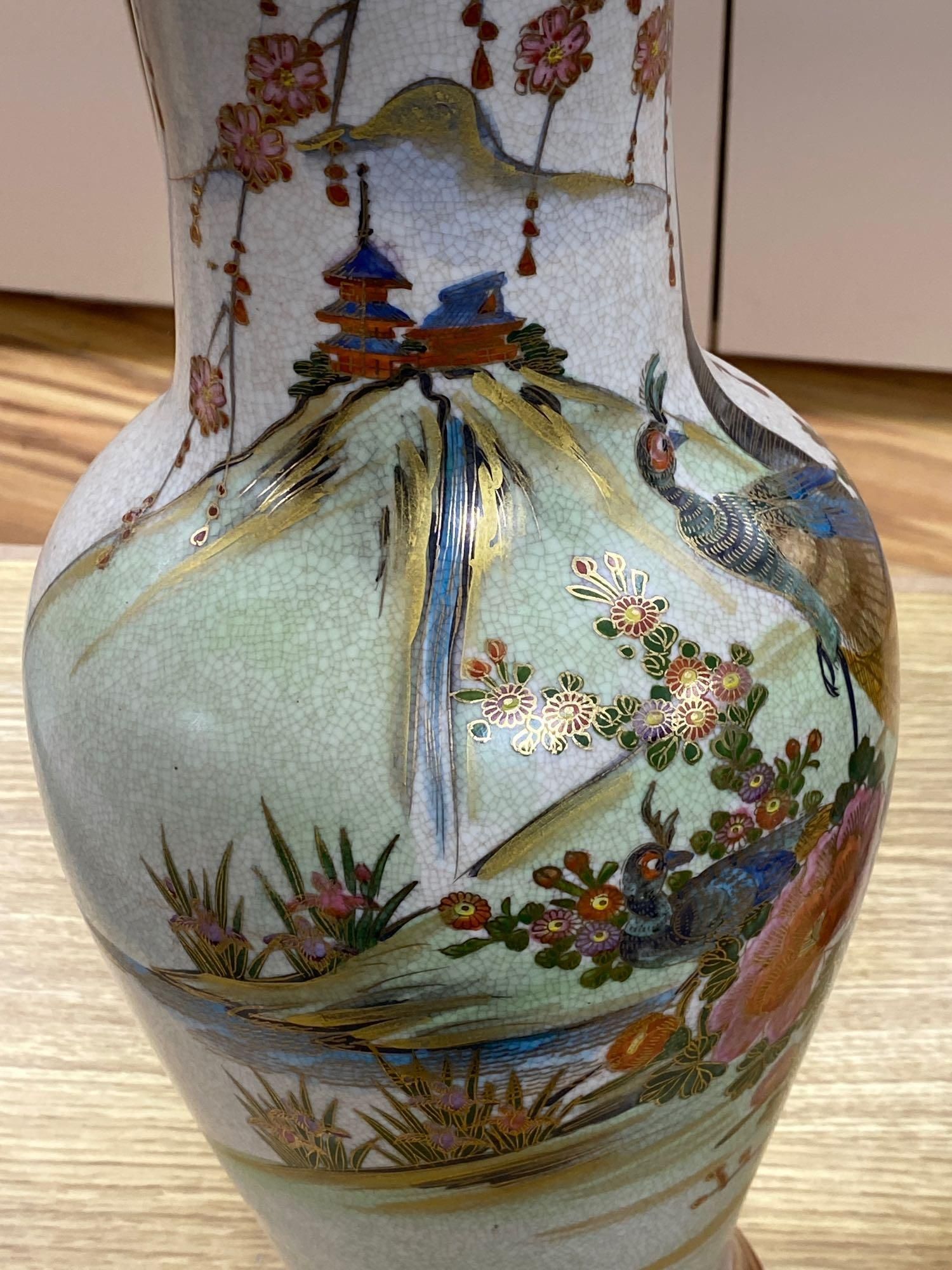 A pair of Japanese satsuma baluster vases, height 46cm, and a satsuma bulbous vase, height 37cm